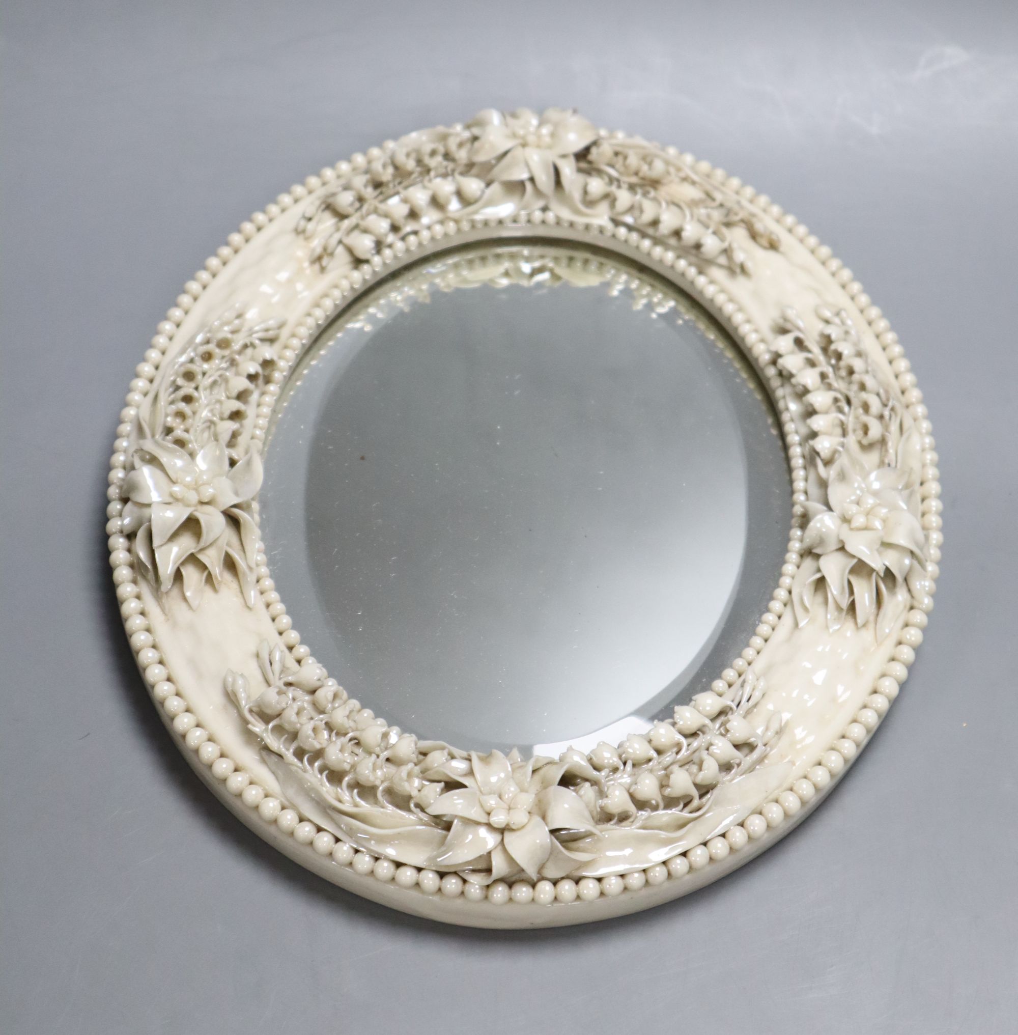 A Belleek oval mirror, first period, length 27cm